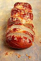 Braided, sweet bread pie, with sliced almonds, breakfast, braided bread, brioche, on a light background, top view, no people [IBR124585358]