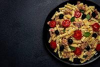 Tuna salad, fusilli pasta, olives and cherry, olive oil, homemade [IBR124585372]