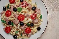Tuna salad, fusilli pasta, olives and cherry, olive oil, homemade [IBR124585376]