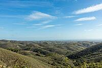 Stunning panoramic view from Miradouro de Vale Covo in Algarve, Portugal, overlooking rugged cliffs, golden beaches, and the turquoise Atlantic Ocean. A perfect scene capturing the natural beauty of southern Portugal's coastline [IBR124586570]