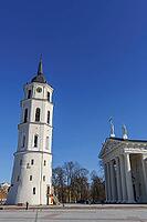 Church tower and classicist church under clear blue sky, Vilnius, Lithuania, Baltic States [IBR124586574]