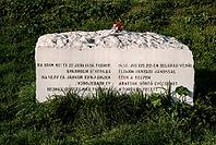 Belgrade, Serbia - March 29, 2014 - Historical stone monument with multilingual inscription in grassy park setting [IBR124626840]