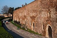 Belgrade, Serbia - March 29, 2014 - Historical brick fortress walls with people walking nearby on a sunny day [IBR124626844]