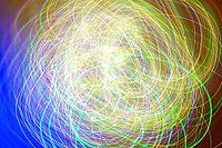Dynamic and colorful light trails create a captivating abstract pattern. this lively composition features swirling lines in a spectrum of colors, evoking motion and energy [IBR124626893]