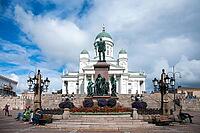 Helsinki, Finland - August 28, 2014 - Helsinki cathedral with cloudy sky and statue in the foreground [IBR124626904]