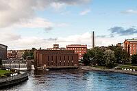 Tampere, Finland - August 29, 2014 - Scenic urban river view with historic brick buildings [IBR124626905]