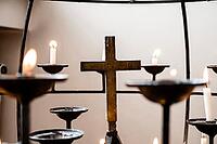Serenity and reflection with candles and cross in peaceful setting [IBR124626915]