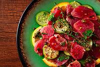 Sicilian tuna crudo, on a green plate, wooden table, Italian dish, homemade, no people [IBR124629124]