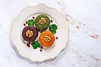 Assortment of Phali, three types, pumpkin, spinach and beetroot, on a round plate, Georgian dish, appetizer with nuts and spices, no people, homemade [IBR124629126]