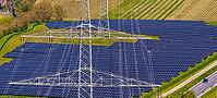 Open-space photovoltaic system, solar park in Talheim am Neckar. high voltage line. aerial view. Baden-W$00FCrttemberg, Germany [IBR124629476]