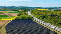 Open-space photovoltaic system, solar park near Bad Rappenau. B$00FCrger.Energie Agri PV system. Vertical solar panels on the motorway. Bad Rappenau, Baden-W$00FCrttemberg, Germany [IBR124629479]