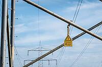 High voltage warning sign on power pole, overhead line, energy infrastructure, Hoya, Lower Saxony, Germany [IBR124631254]
