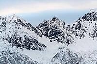Snowy mountain range, Öksfjord, Finnmark, Norway, April 2019 [IBR124636263]
