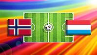Eye-catching football matchup illustration showing Norway and Luxembourg flags facing off across a vibrant green soccer pitch with a centered ball, set against a radiant rainbow gradient background, symbolizing global competition and dynamic sports energy [IBR124642080]