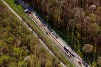 Road under construction near a dense forest area, construction of bicycle path, Aidlingen, Böblingen district, Germany [IBR124642855]