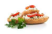 Closeup detail of bread with cottage and tomato over black ardoise tray [IBR124676049]