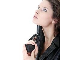 Suicide girl with gun isolated on white background [IBR124692669]