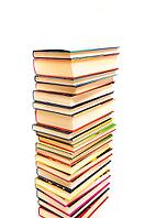 Stack of books against a white background [IBR124748901]
