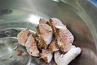 Raw briquette with mushroom mycelium, breaking it, down for laying in mushroom substrates [IBR124748907]