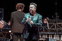 Sebastian Krumbiegel, singer of Die Prinzen live on Symphonica Tour together with the Thüringen Philharmonie Gotha-Eisenach conducted by conductor Christian Dellacher at Berlin's Tempodrom on 23.05.2026 [IBR113223553]