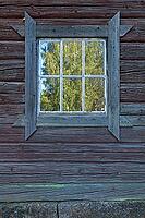 Old wooden window with a rustic frame on a log building, Ruostinpyhtää, Finland [IBR124748940]