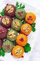 Assortment of Pkhali, pumpkin, spinach and beetroot, Georgian dish, on a white plate, appetizer with nuts and spices, no people, homemade [IBR124748957]