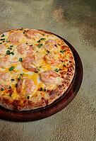 Four cheese pizza with shrimp and fresh microgreens, served on a wooden board, homemade, no people [IBR124748973]