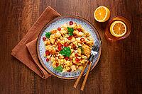 Spicy fried cauliflower served on a wooden countertop [IBR124748983]