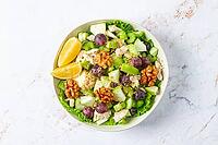 Fresh Waldorf salad, celery stalk with chicken, apple and walnuts, grapes, herbs, homemade, without people [IBR124748990]