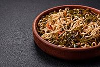 Food, Asian dish rice noodles with salt and spices on dark concrete background [IBR124773750]