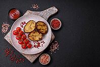 Food, Delicious potato halves in skins baked on the grill with salt, spices and herbs [IBR124773751]