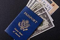 Food, United states of america passport, airline tickets and money on a dark concrete background. Conceptual background on the theme of tourism and travel [IBR124773752]