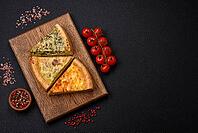 Food, Delicious quiche with broccoli, chicken or salmon and cheese with salt and spices on a dark concrete background [IBR124773760]