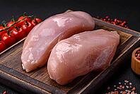 Food, Fresh chicken fillet on a dark concrete table with spices and herbs. Preparation for cooking meat dishes [IBR124773775]