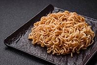 Food, Asian dish rice noodles with salt and spices on dark concrete background [IBR124773778]