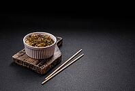Food, Asian dish rice noodles with salt and spices on dark concrete background [IBR124773779]