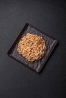 Food, Asian dish rice noodles with salt and spices on dark concrete background [IBR124773781]