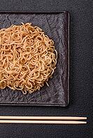 Food, Asian dish rice noodles with salt and spices on dark concrete background [IBR124773782]