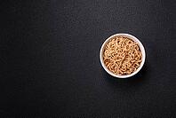 Food, Asian dish rice noodles with salt and spices on dark concrete background [IBR124773785]
