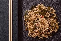 Food, Asian dish rice noodles with salt and spices on dark concrete background [IBR124773790]