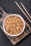 Food, Asian dish rice noodles with salt and spices on dark concrete background [IBR124773792]