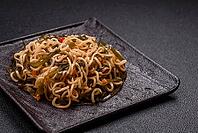 Food, Asian dish rice noodles with salt and spices on dark concrete background [IBR124773795]