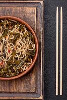 Food, Asian dish rice noodles with salt and spices on dark concrete background [IBR124773797]