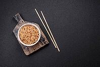 Food, Asian dish rice noodles with salt and spices on dark concrete background [IBR124773798]
