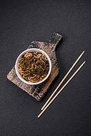 Food, Asian dish rice noodles with salt and spices on dark concrete background [IBR124773801]