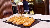 Grilled Prawns Typical Spanish Tapa and Beers at Restaurant Bar, Spain [IBR124794765]