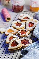 Homebaked Christmas Cookies With fruit Jam filling and Icing Sugar [IBR124817840]