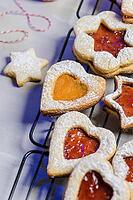 Homebaked Christmas Cookies With fruit Jam filling and Icing Sugar [IBR124817841]