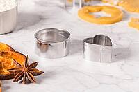 Raw dough for christmas cookies and cookie cutters on marble surface [IBR124817842]