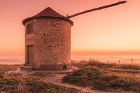 Old traditional wind-mill in sand-hills of Apulia Portugal [IBR124817867]